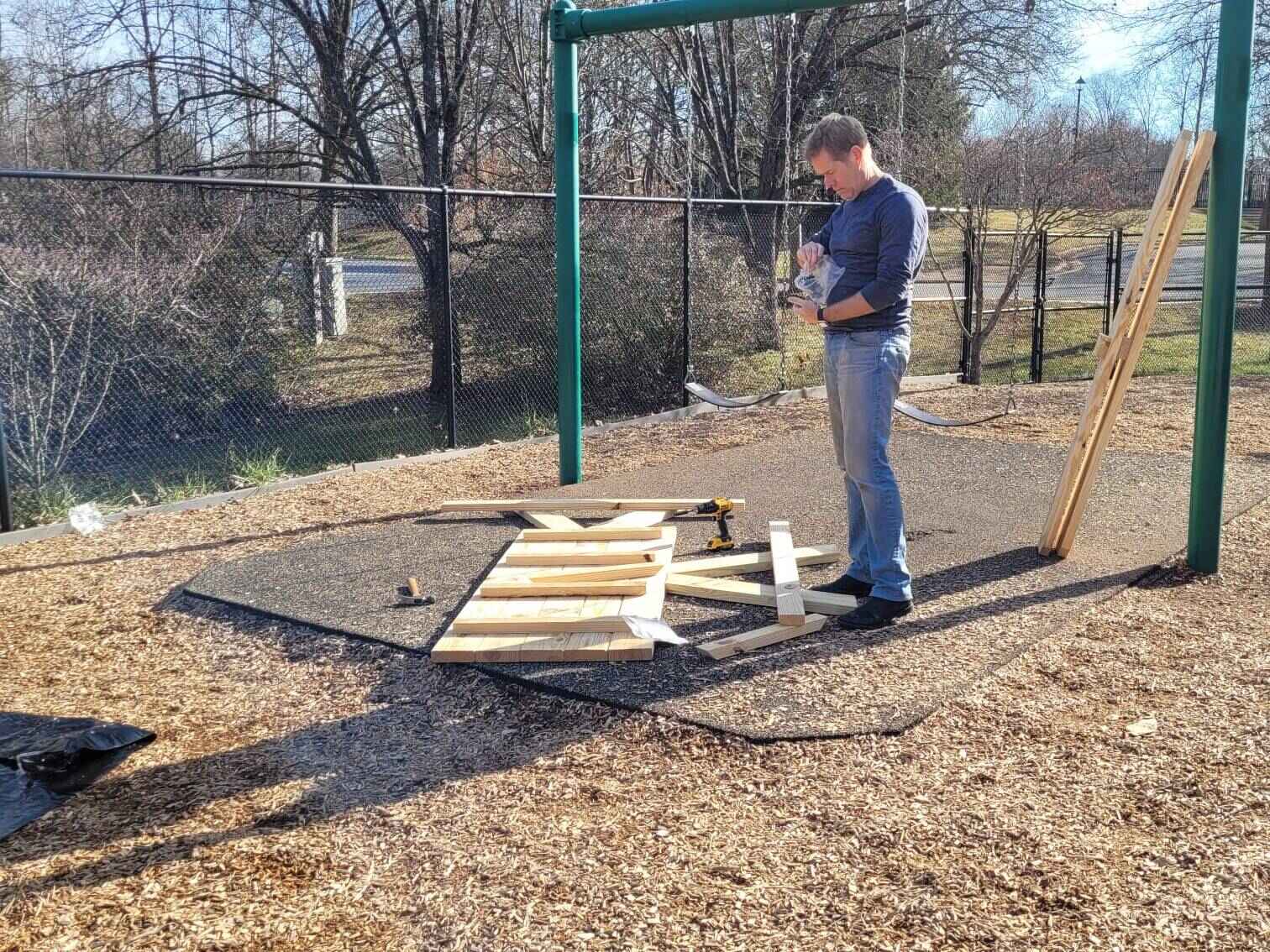 Adult Volunteer checking the instructions